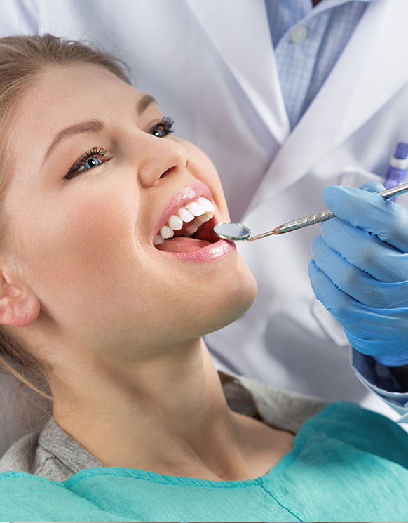 a woman getting a dental check-up