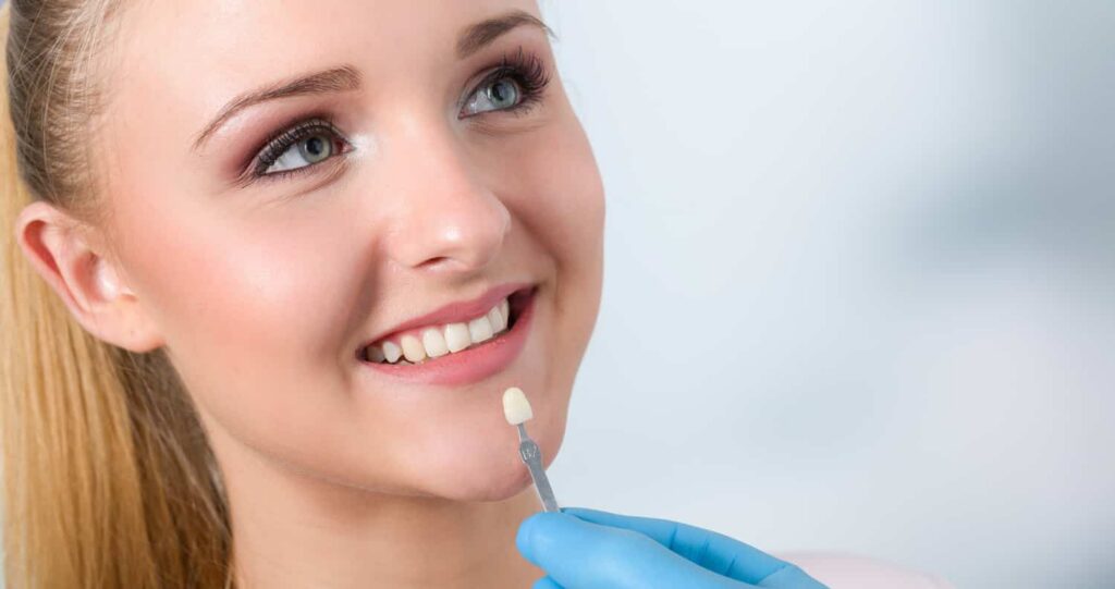 a woman being fitted for a tooth crown
