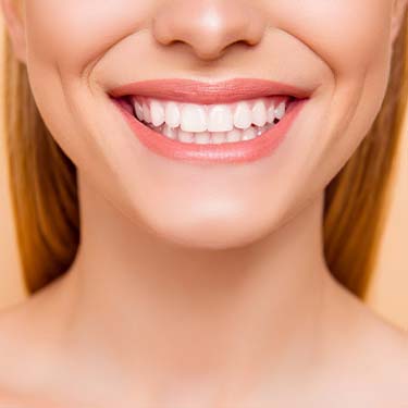 a smiling women after cosmetic dentistry at smith dentalworks