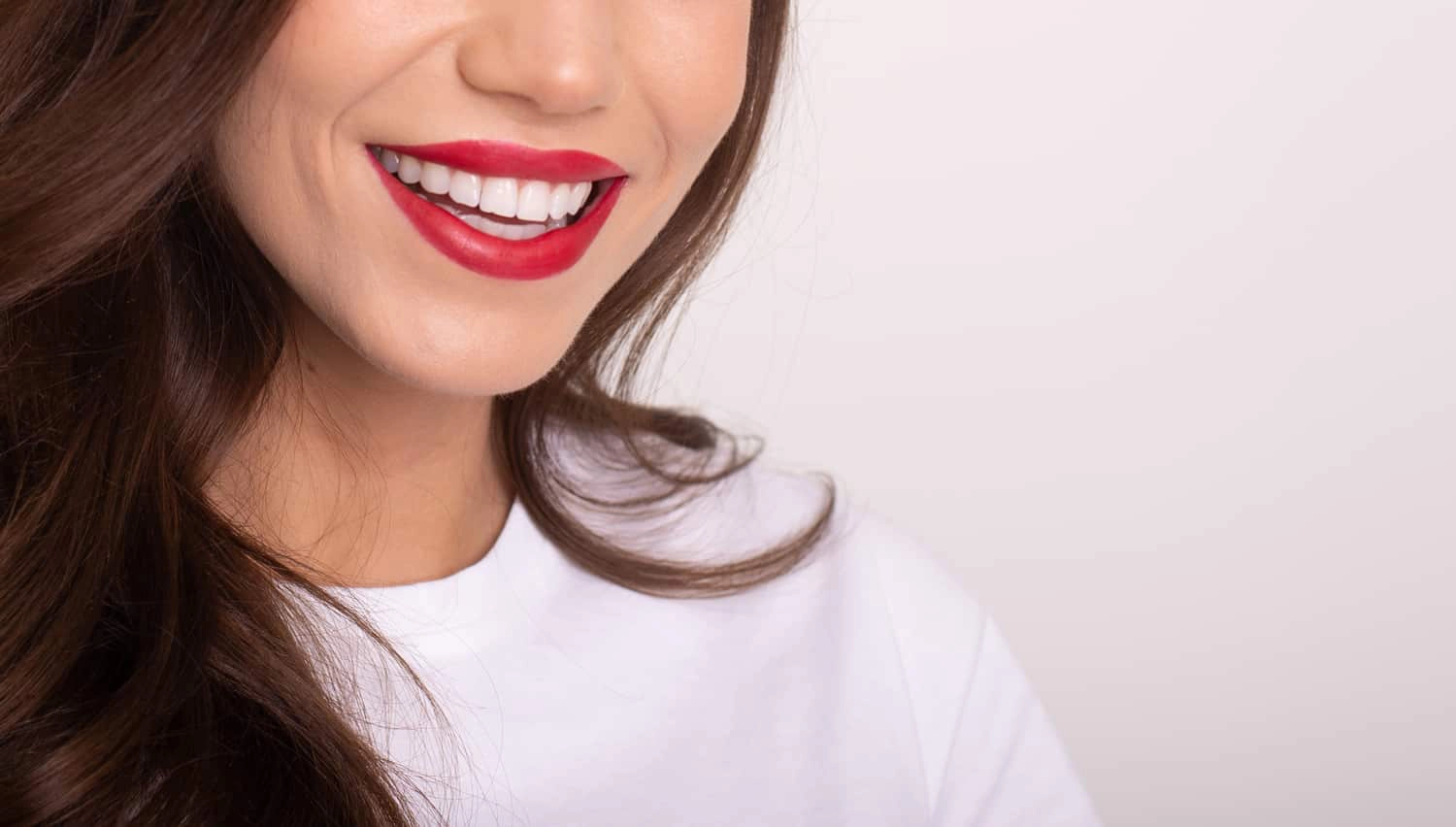 a woman smiling after finding the best teeth whitening method at smith dentalworks