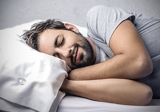 a man having restful sleep after sleep apnea treatment