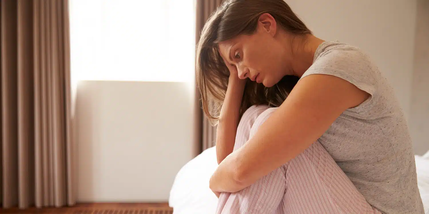 a woman feeling tired and depressed due to sleep apnea