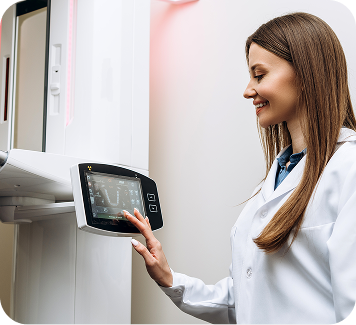 Dental professional operating advanced CBCT 3D digital imaging system for precise diagnostics and enhanced patient care.