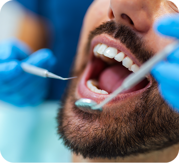 Patient receiving dental examination with tools, highlighting innovative dental care at Smith Dentalworks.
